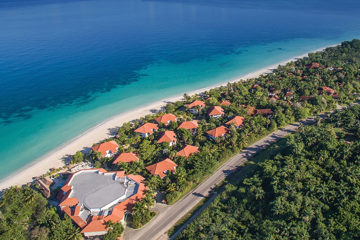 a group of houses on a beach