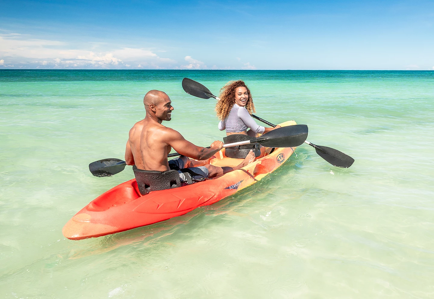 a man and woman in a kayak