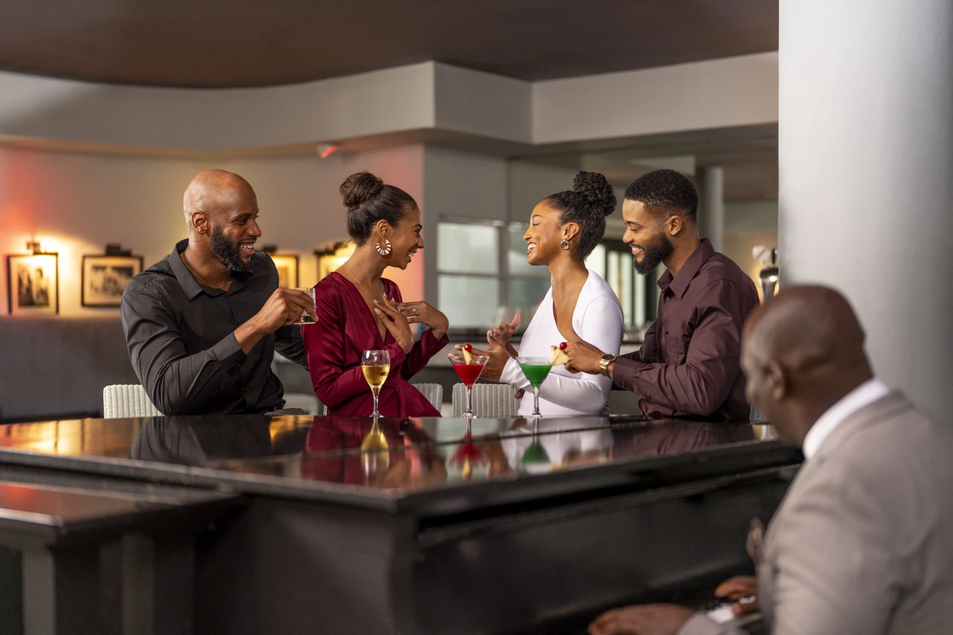 a group of people sitting at a bar