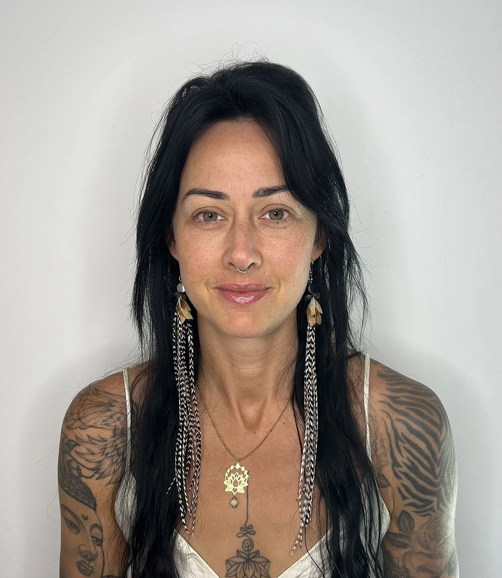 a woman with tattoos and a nose ring