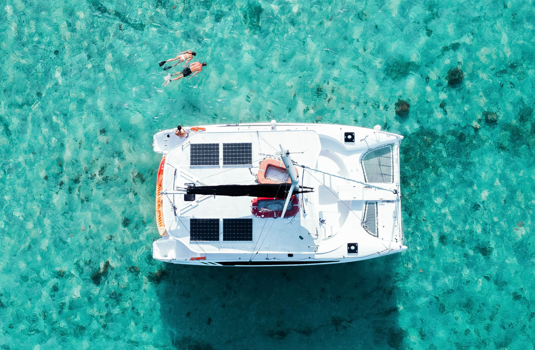 a group of people swimming in a boat