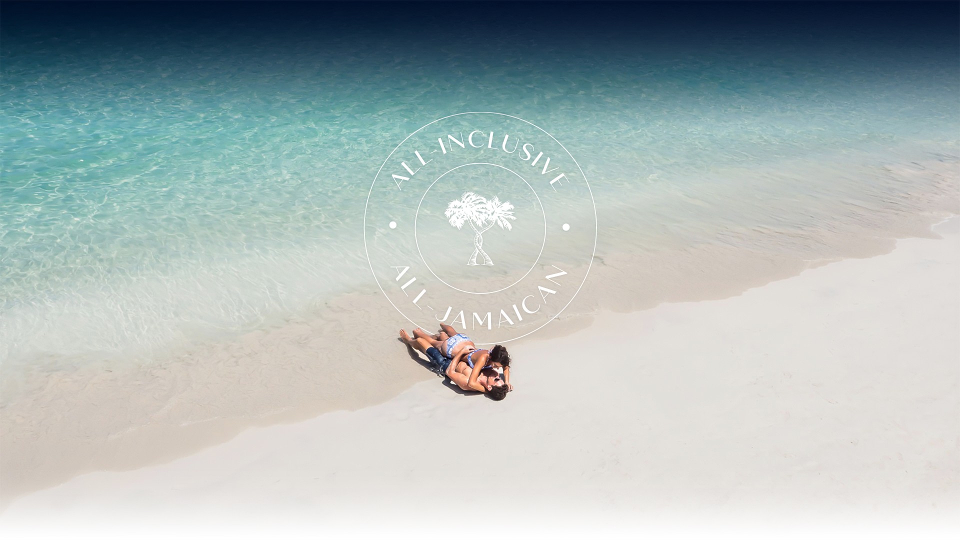 a couple lying on a beach