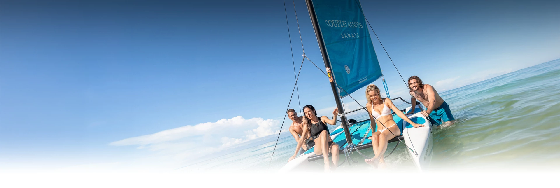 a group of people on a sailboat