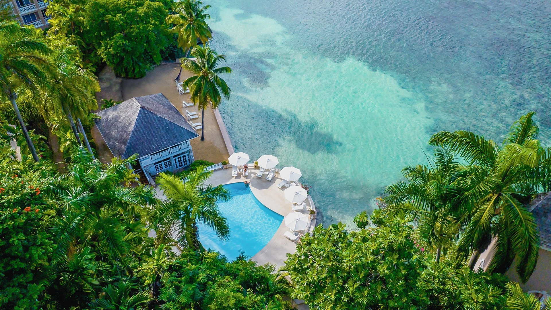 a swimming pool next to a body of water