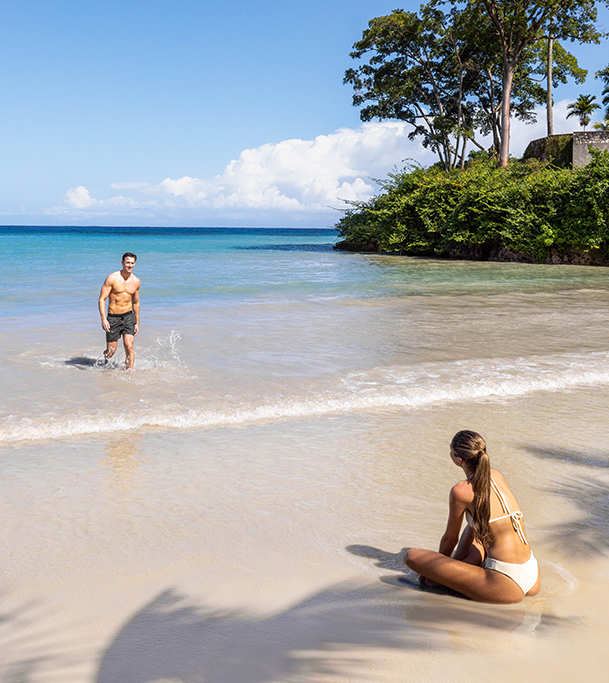 a man and woman on a beach