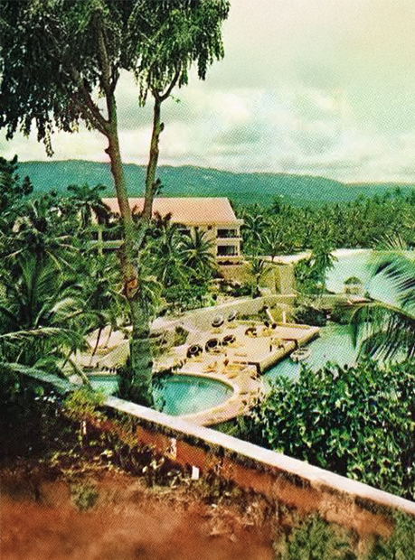a pool and a building with trees around it