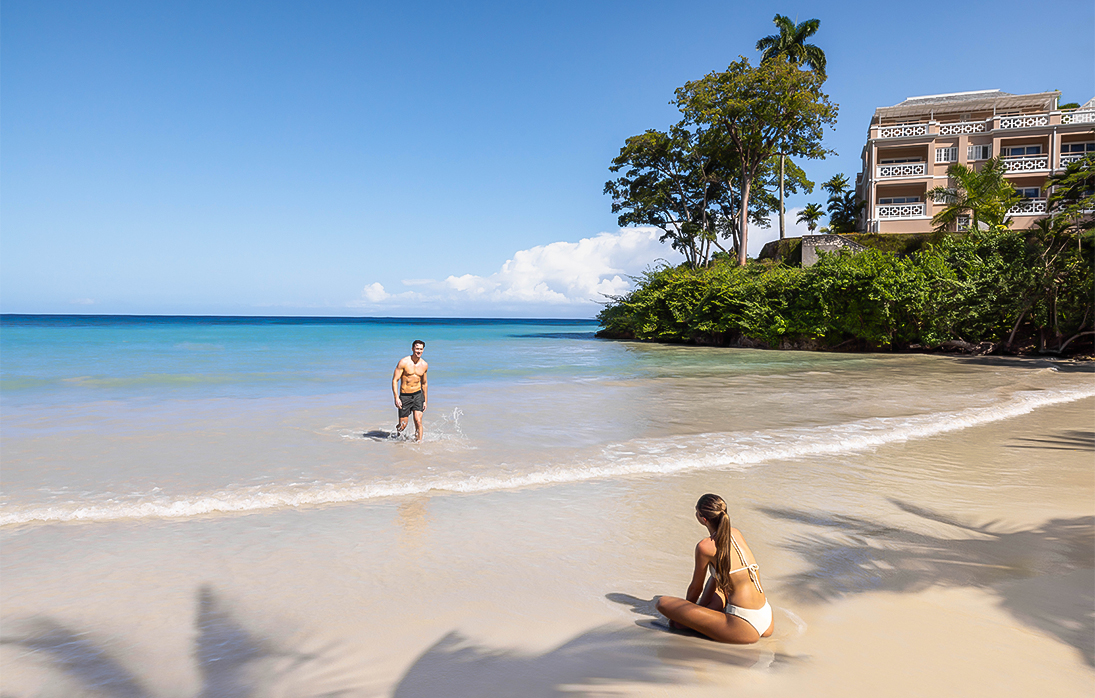 a man and woman on a beach