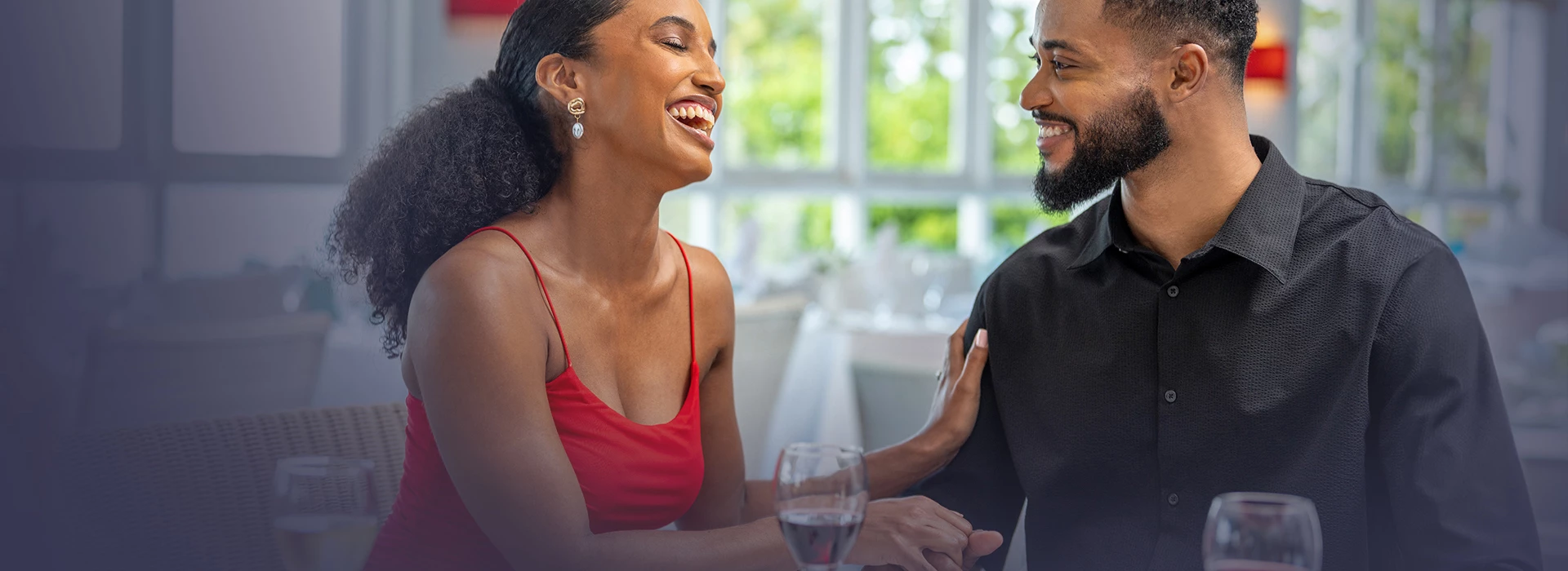 a man and woman laughing at each other