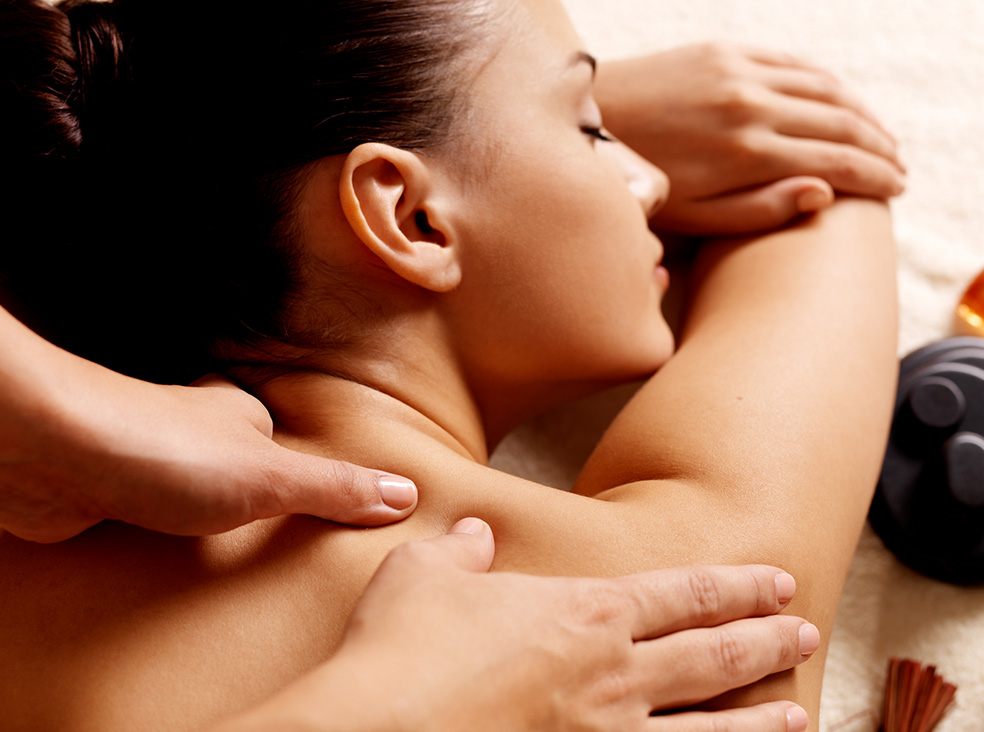 a woman receiving a back massage
