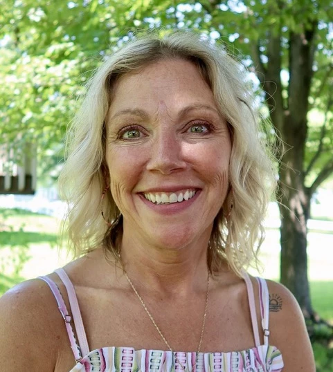 a woman smiling at camera