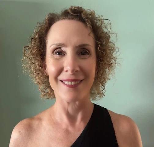 a woman smiling for a picture