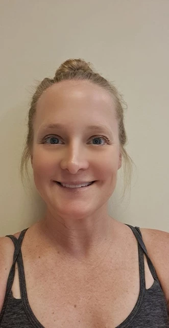 a woman smiling for the camera