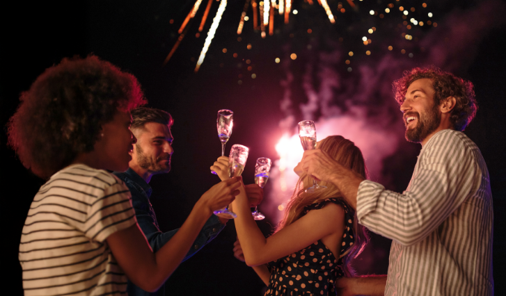 a group of people holding champagne glasses