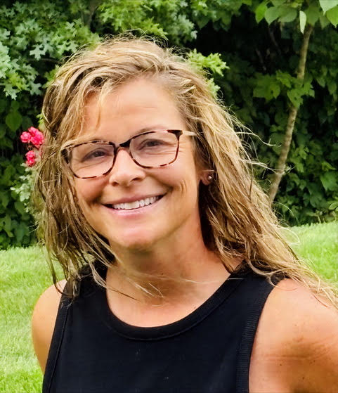 a woman smiling at camera
