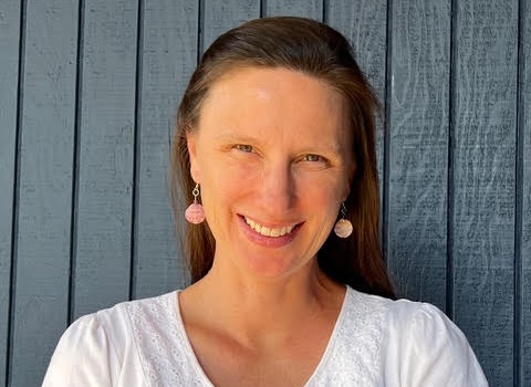 a woman smiling at the camera
