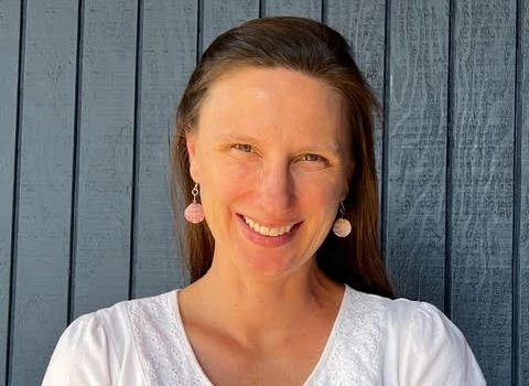 a woman smiling at the camera