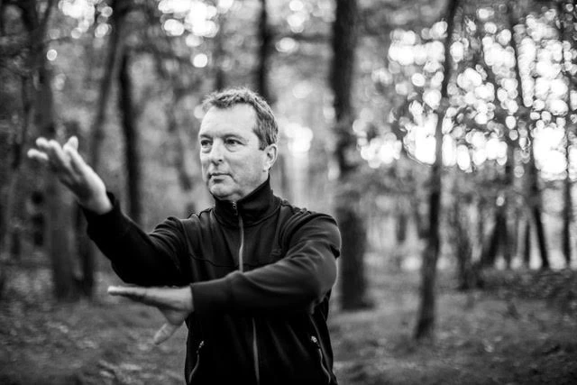 a man in a black jacket