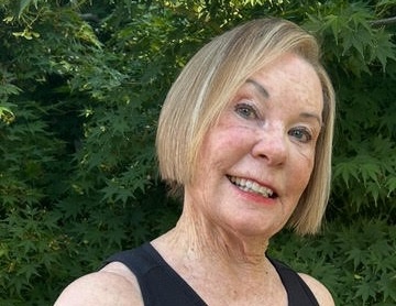 a woman smiling at the camera