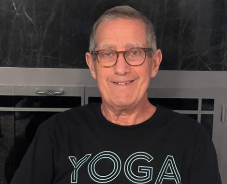 a man wearing glasses and a black shirt