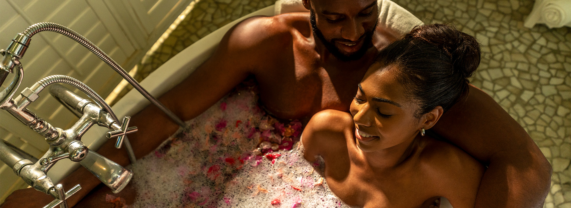 a man and woman in a bathtub
