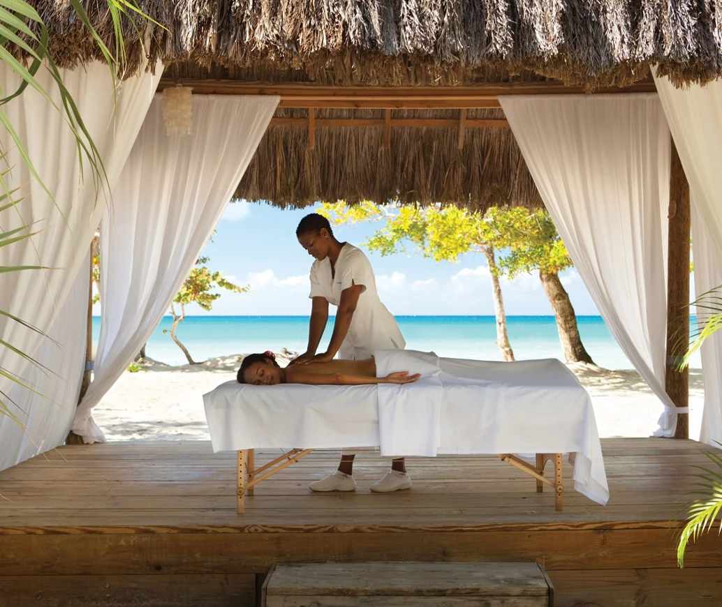 a woman receiving a massage on a bed