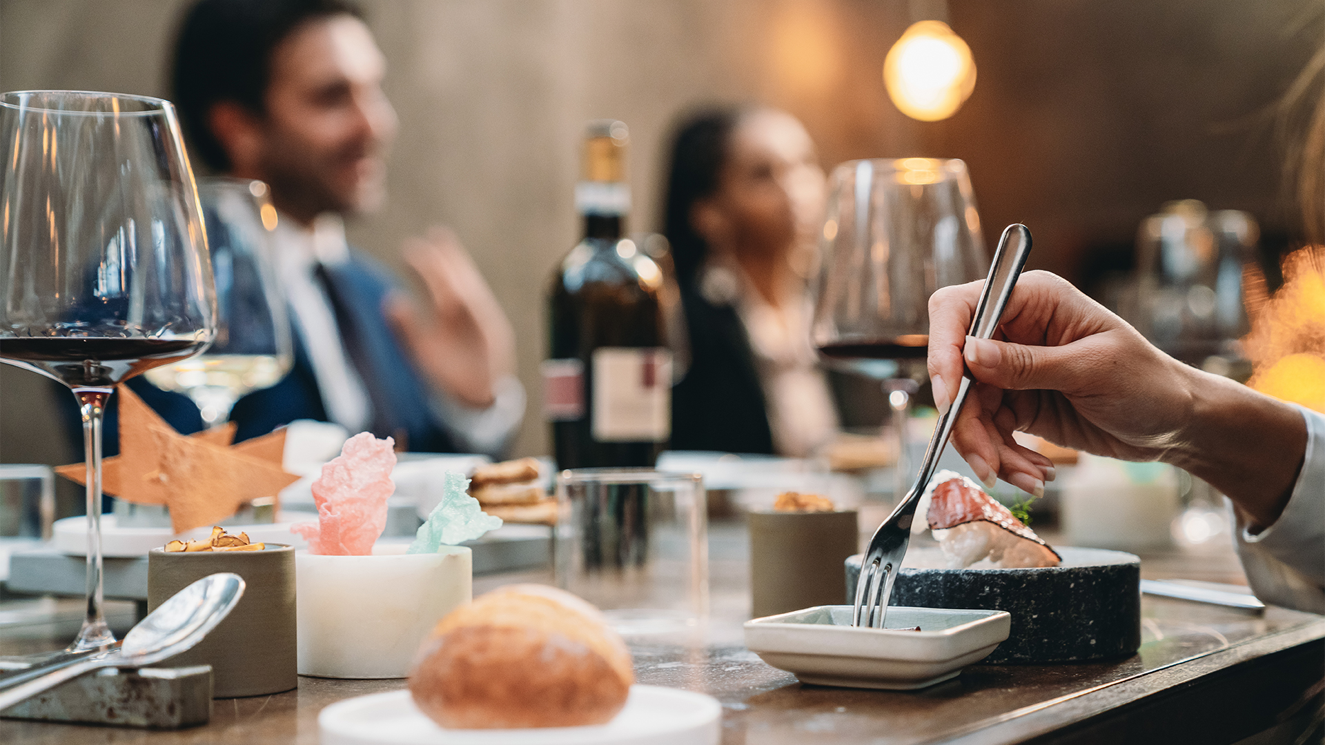 a person eating food at a restaurant