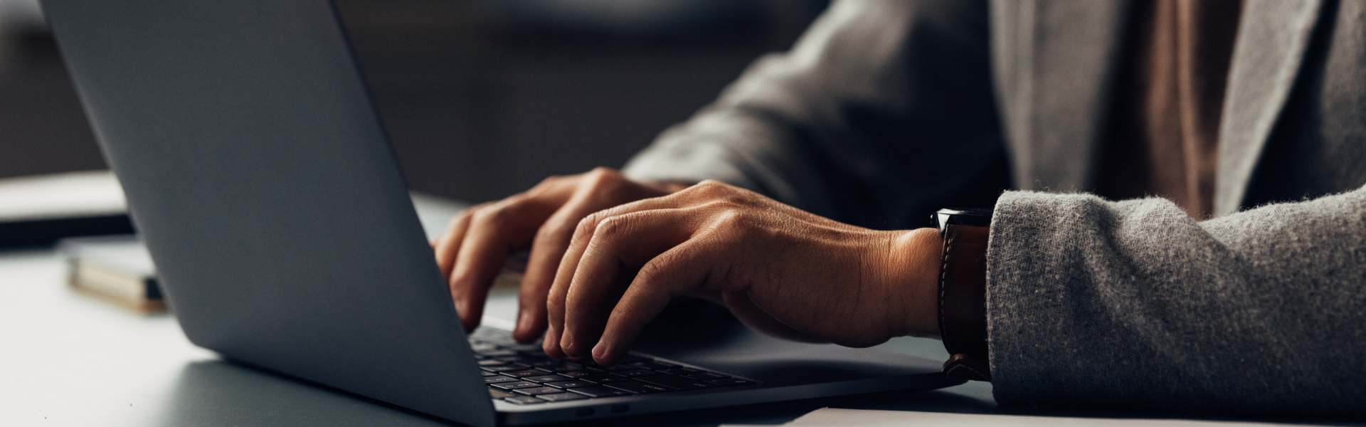 a person typing on a laptop