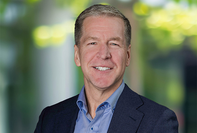 a man in a blue shirt and suit