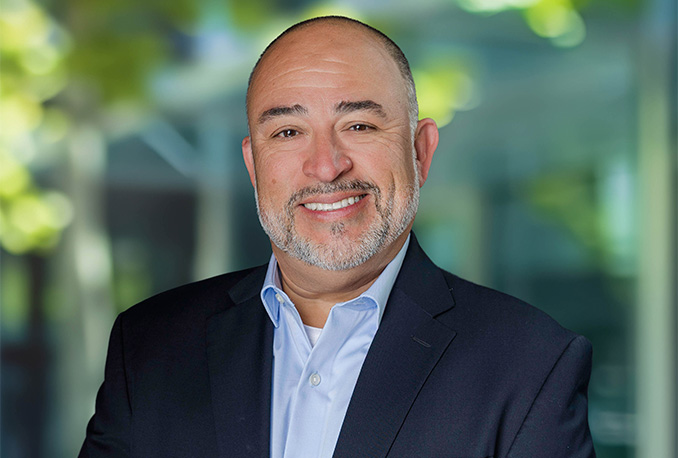 a man in a suit smiling