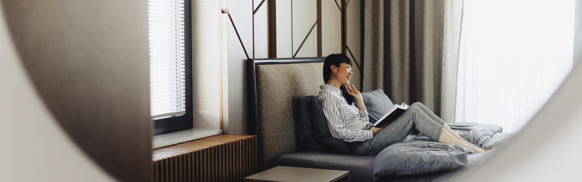 a woman sitting on a bed