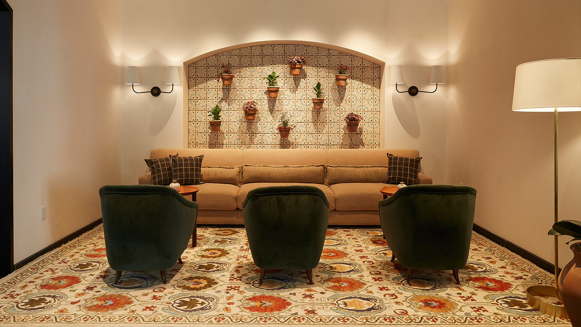 a room with a couch and chairs