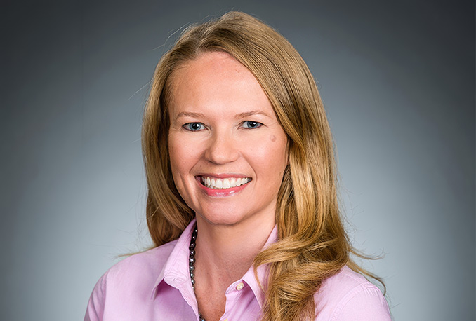a woman smiling for a picture