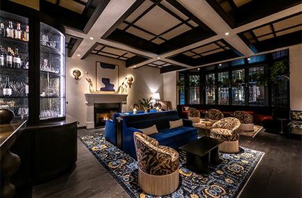 a room with a fireplace and couches