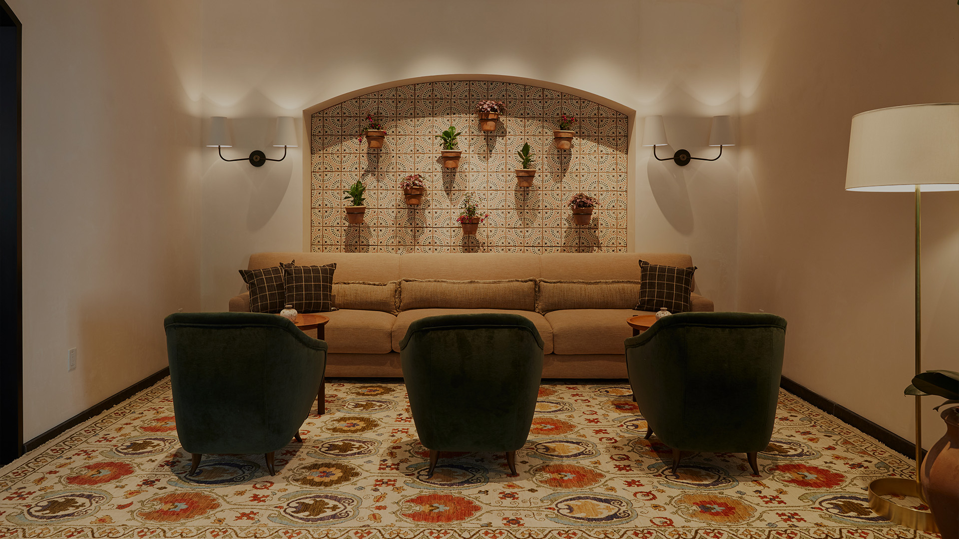 a room with a couch and chairs