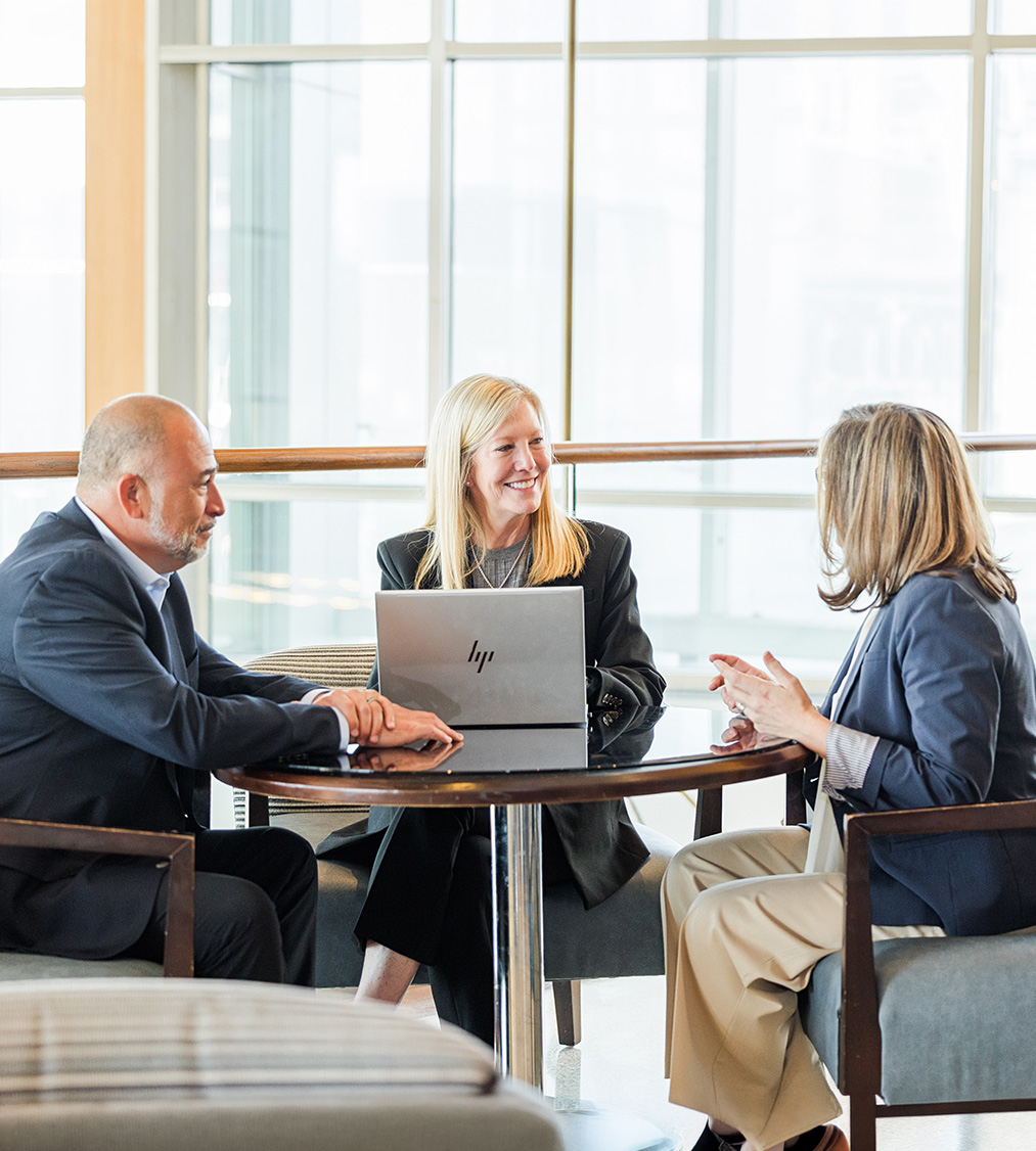 a group of people sitting around a table