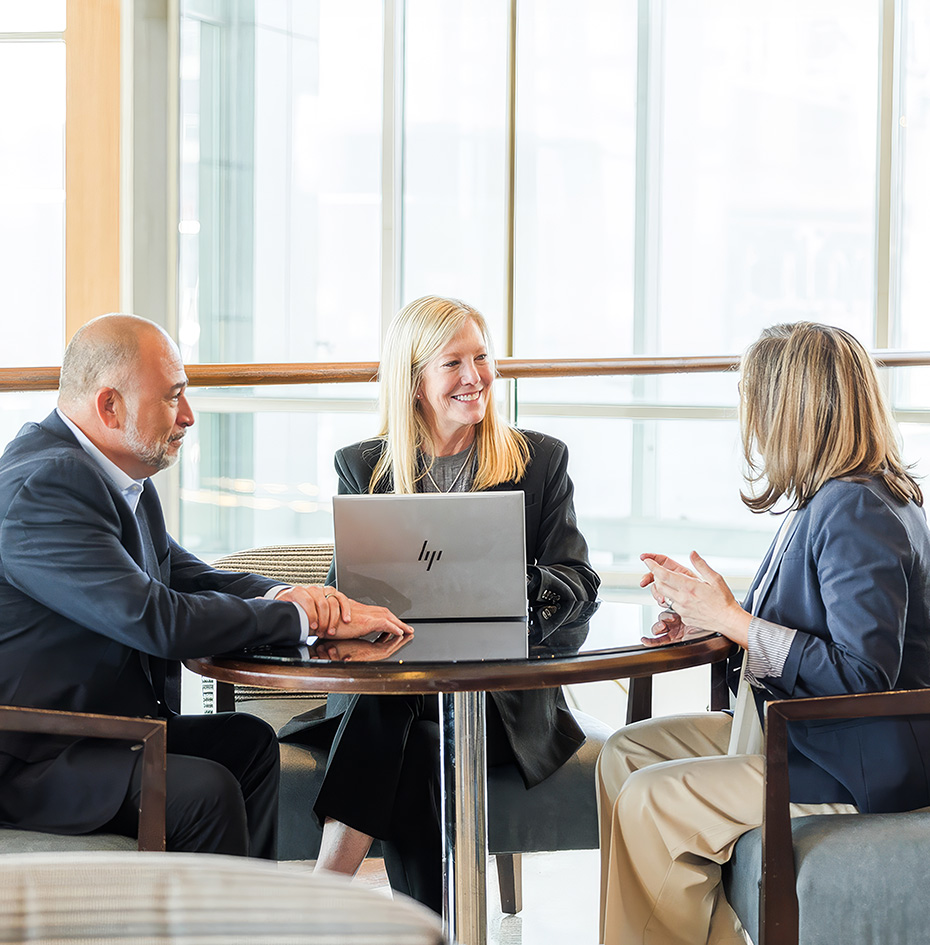 a group of people sitting around a table