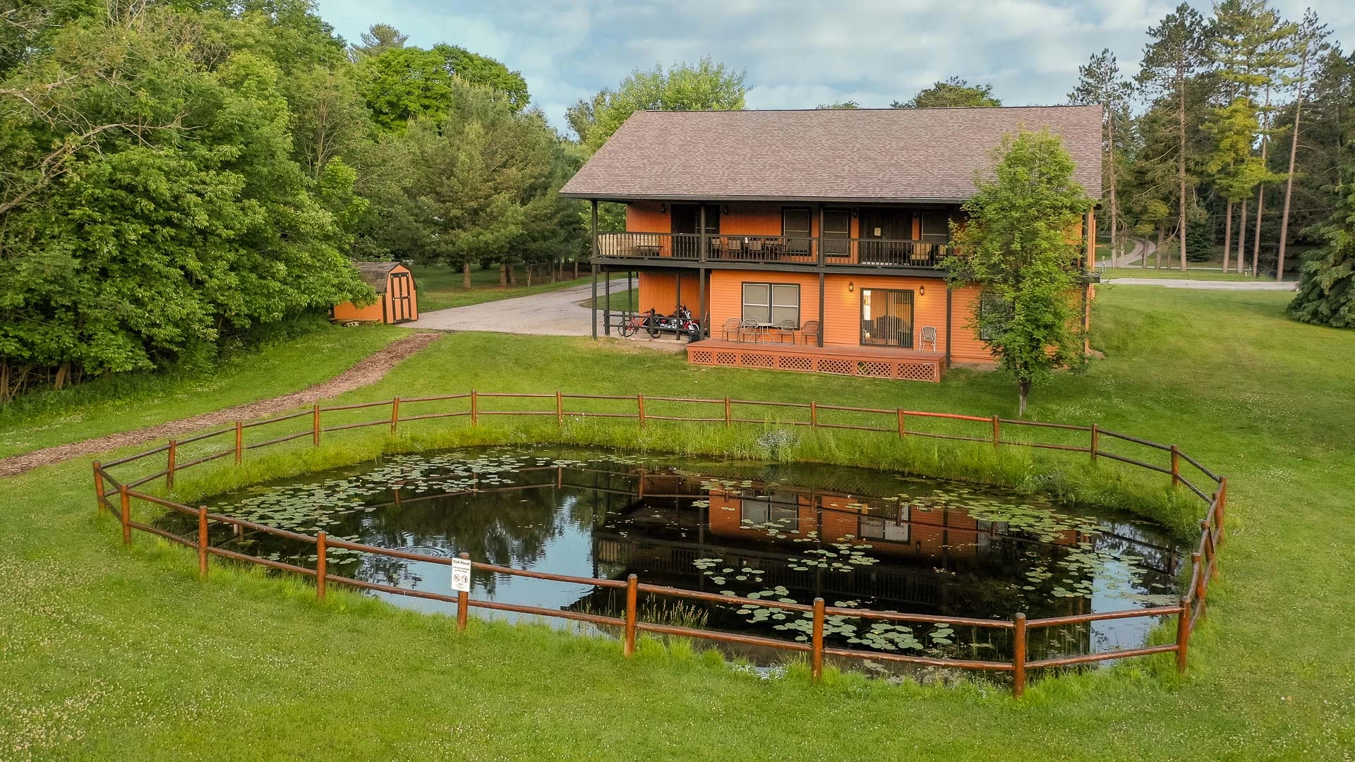 a pond in front of a house