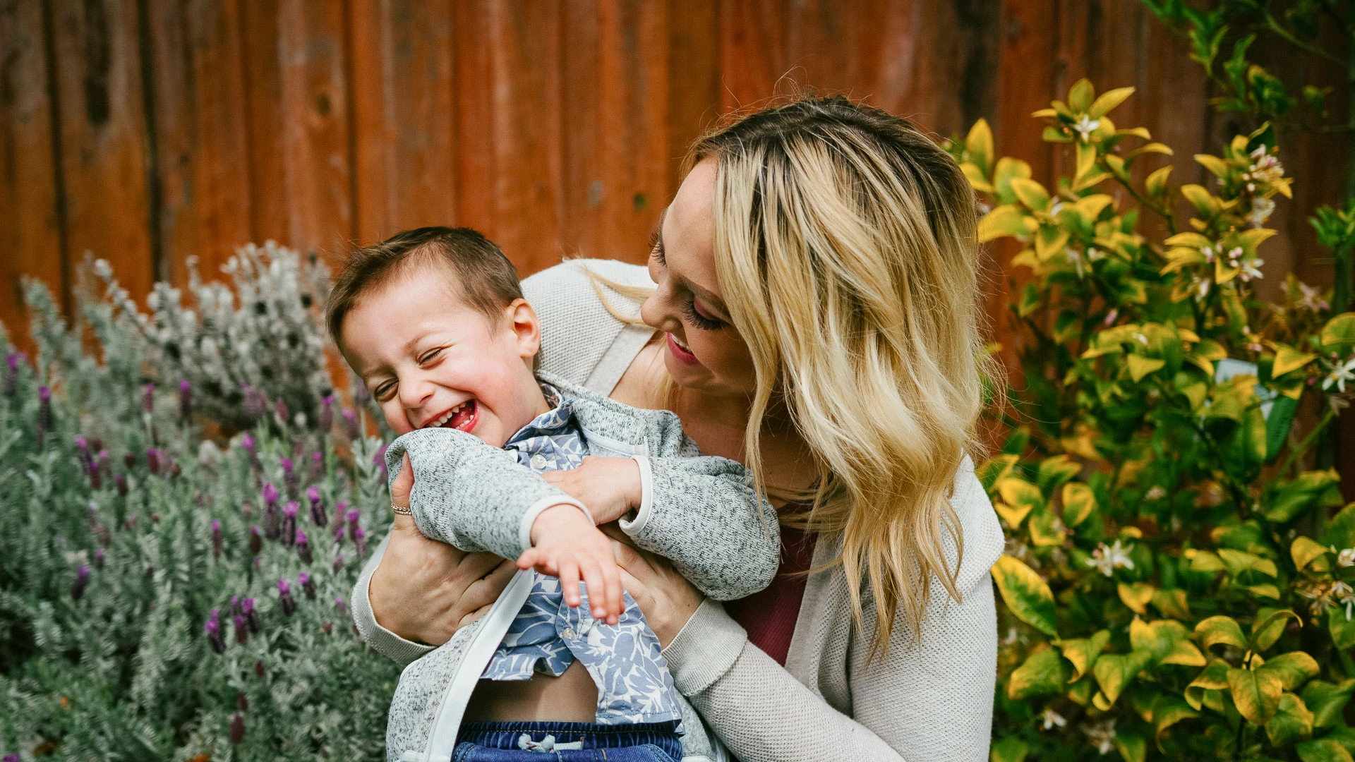 a woman holding a baby
