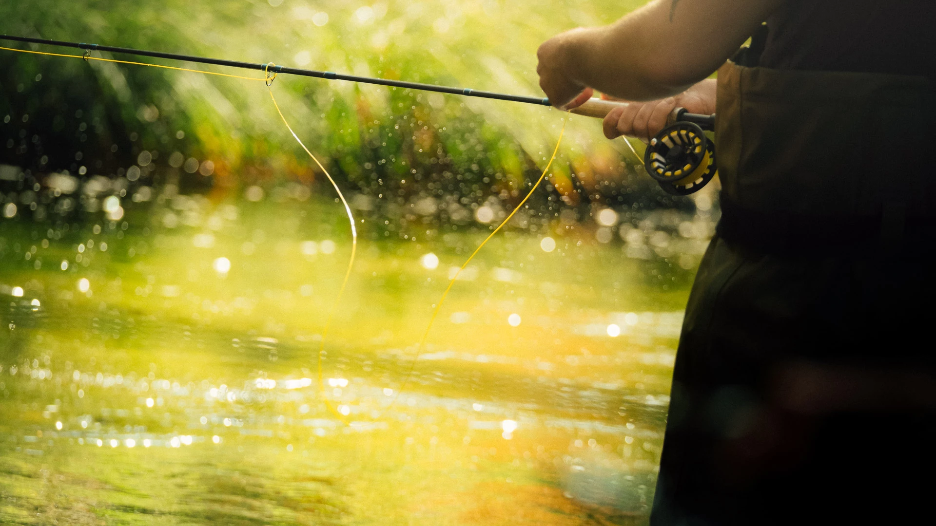 a man holding a fishing pole