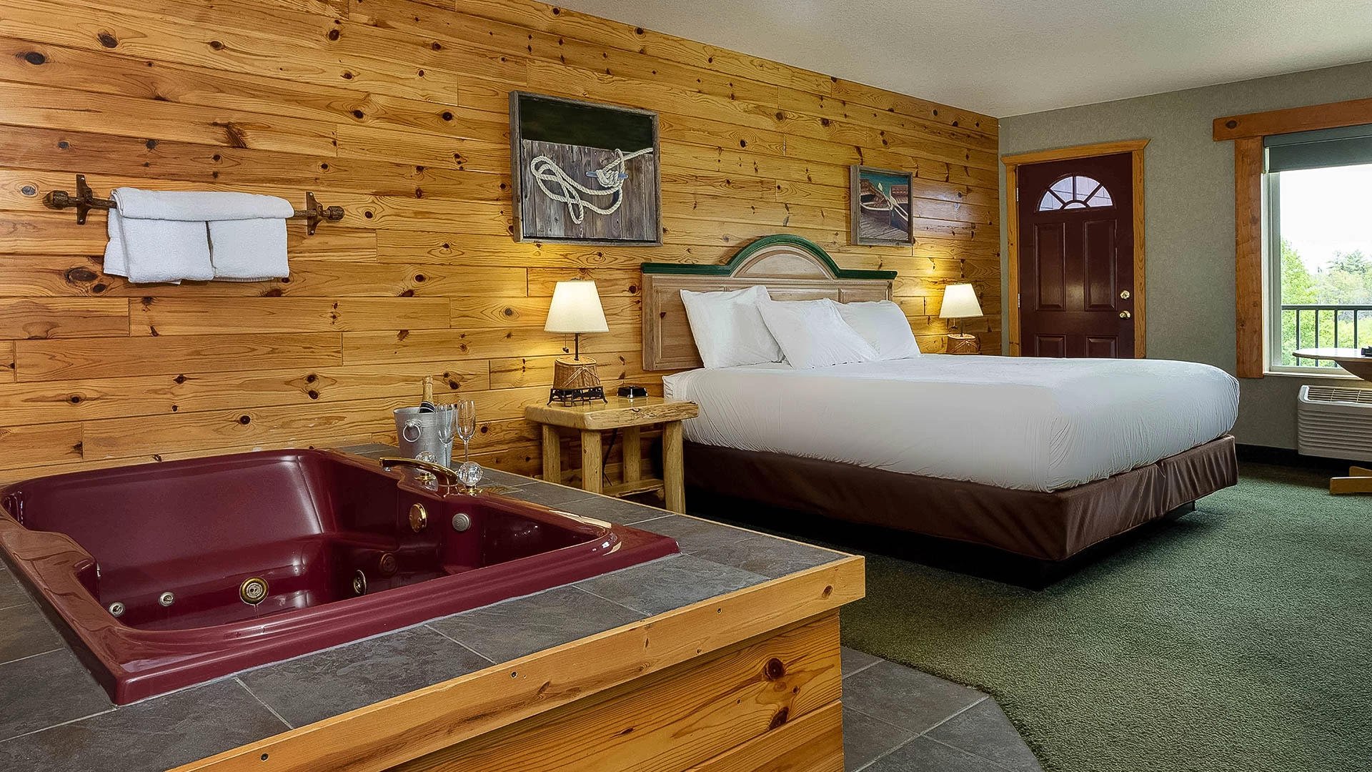 a room with a bed and a hot tub