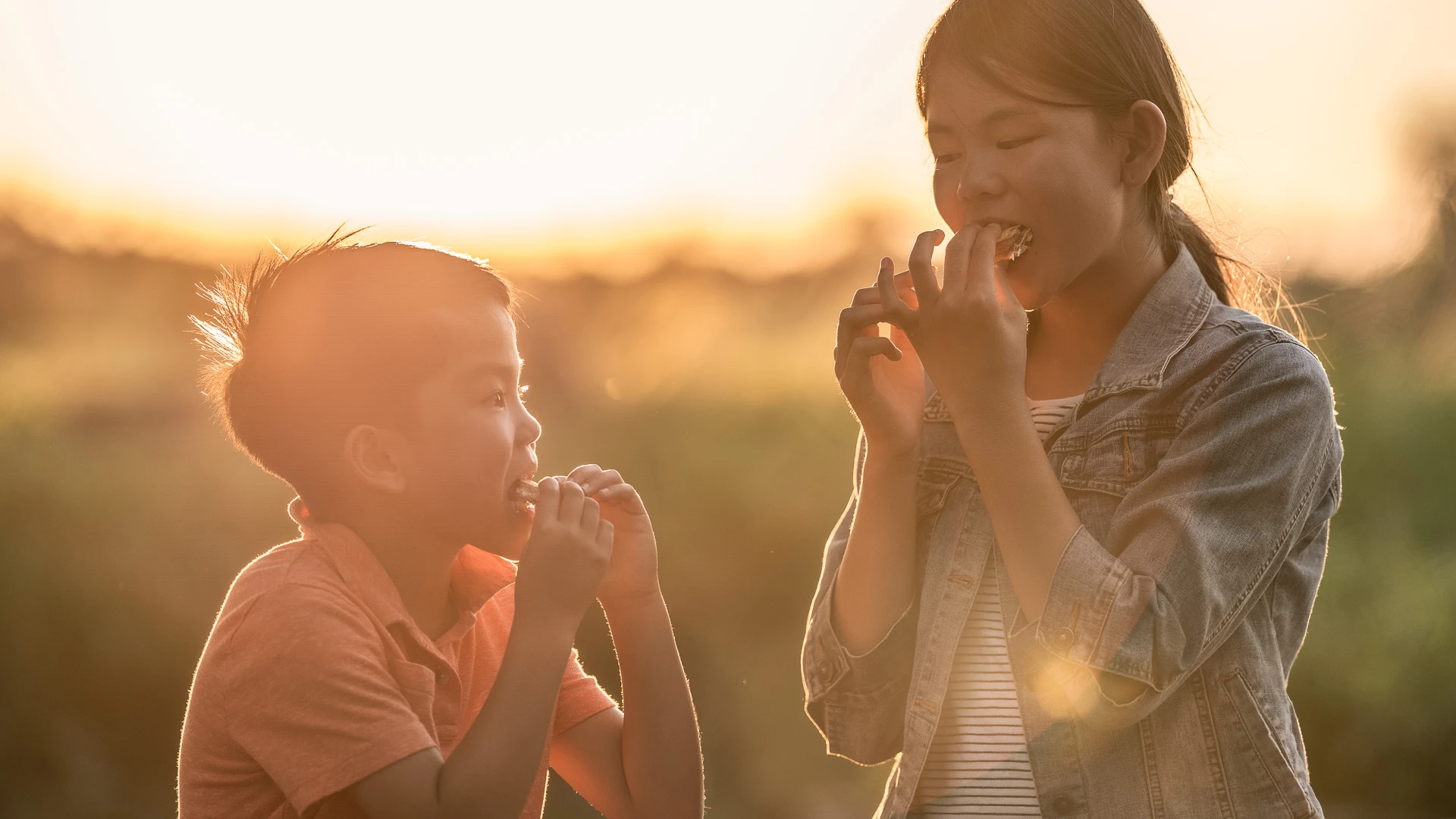 a boy and girl eating food