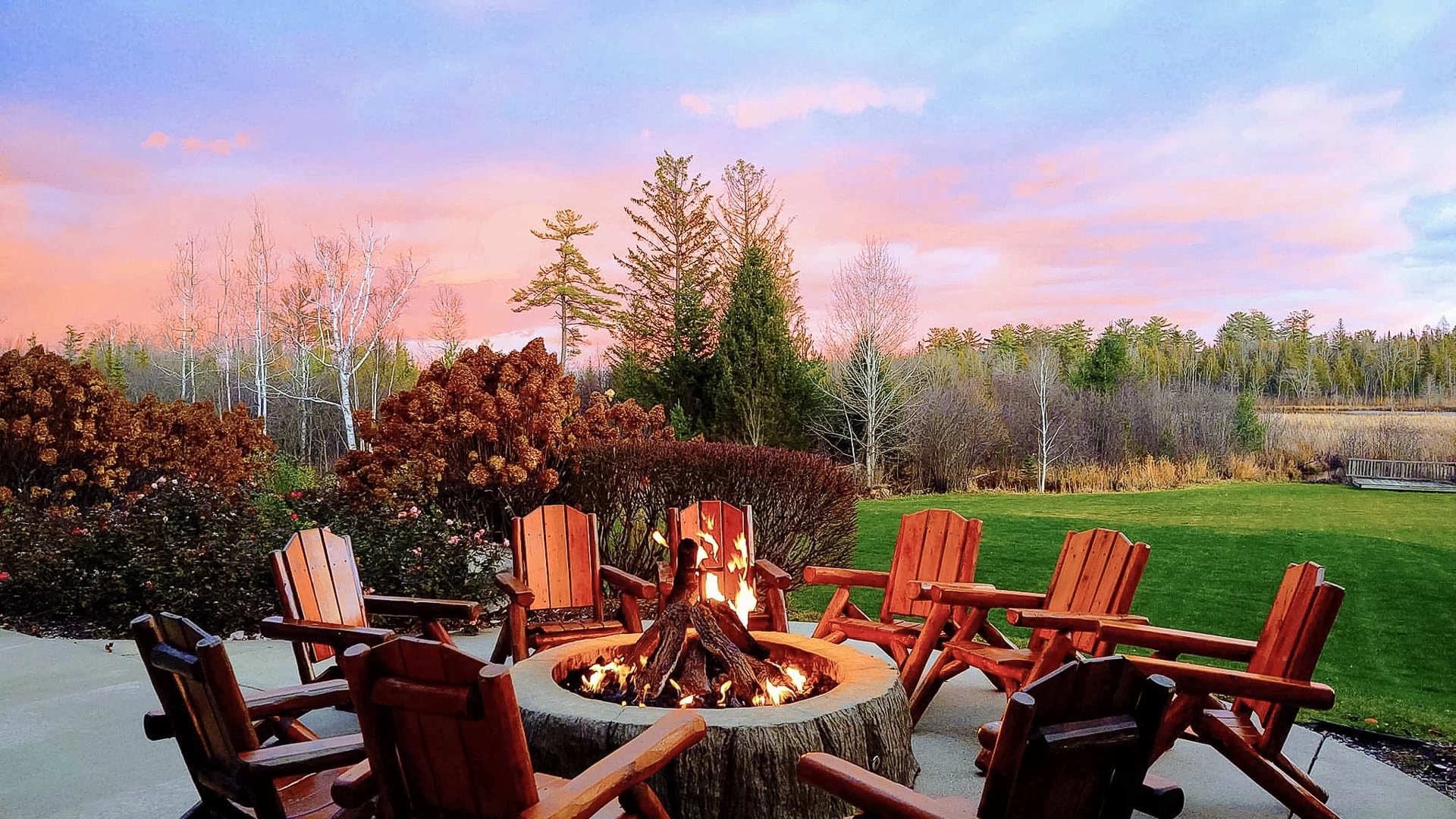 a fire pit with chairs around it