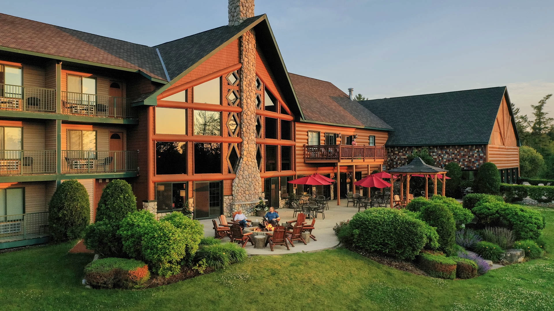 a building with a patio and a lawn