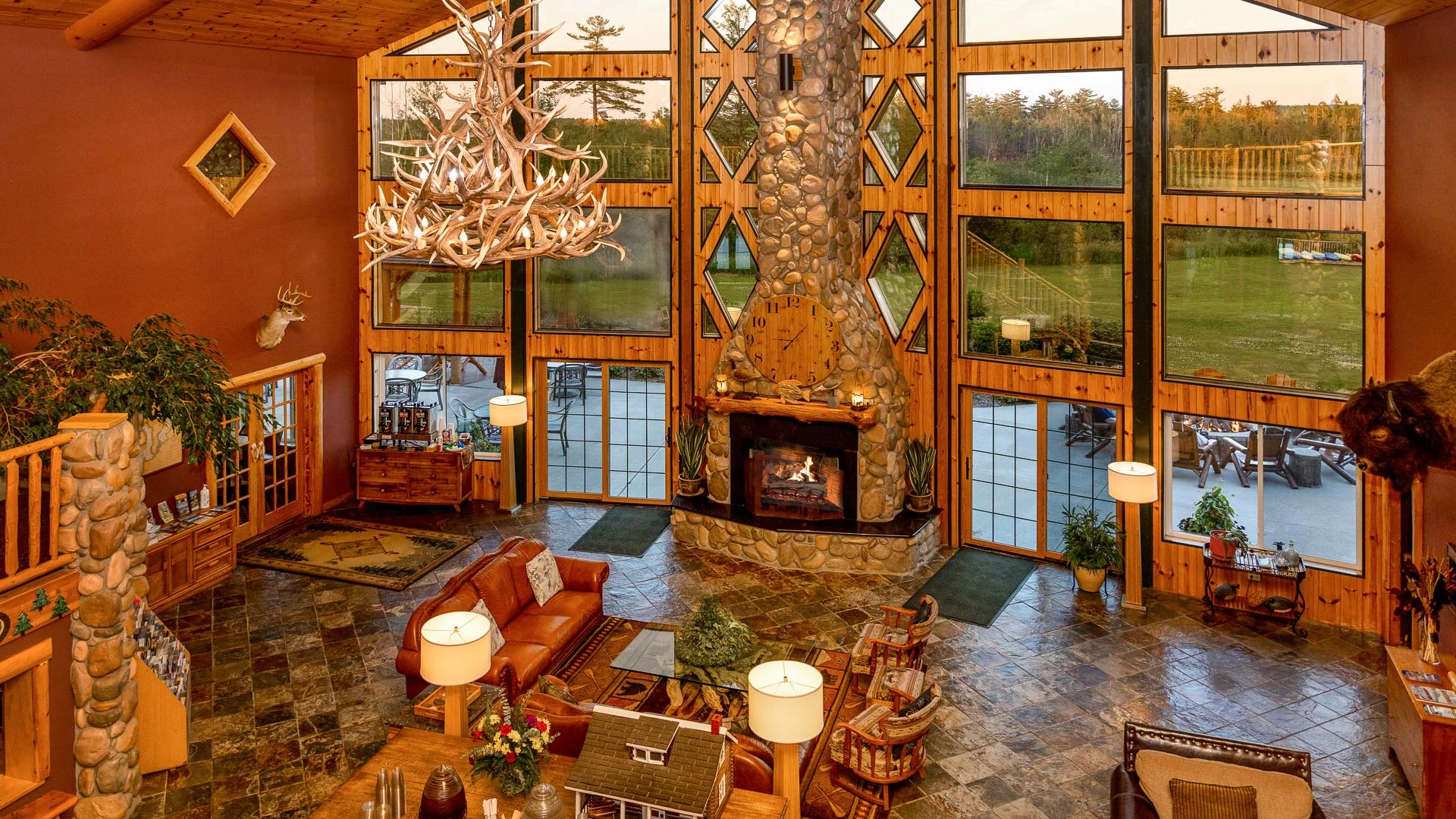 a living room with a fireplace and a chandelier