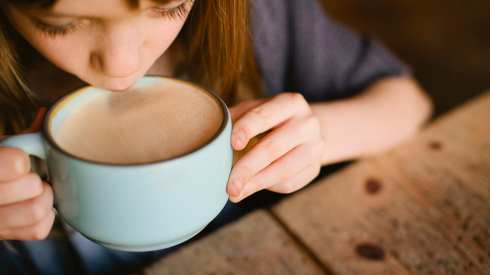 a person drinking from a cup