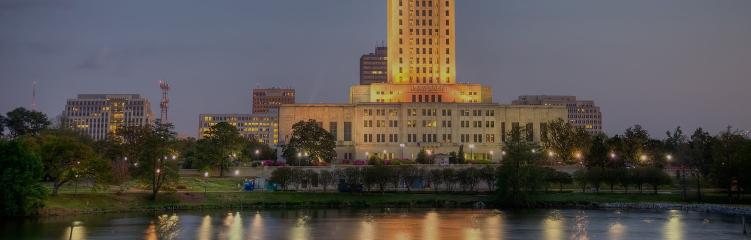 Crowne plaza baton rouge at night in front of a lake