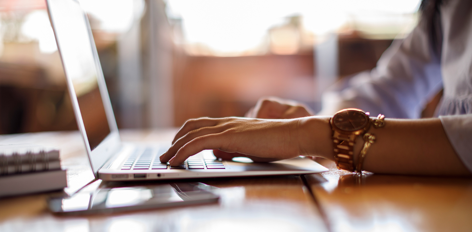 Close up of woman typing