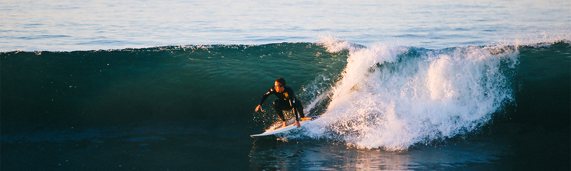 a man surfing on a wave