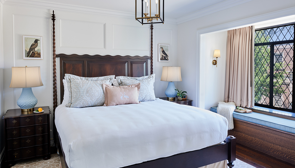 a bed with a white bed spread