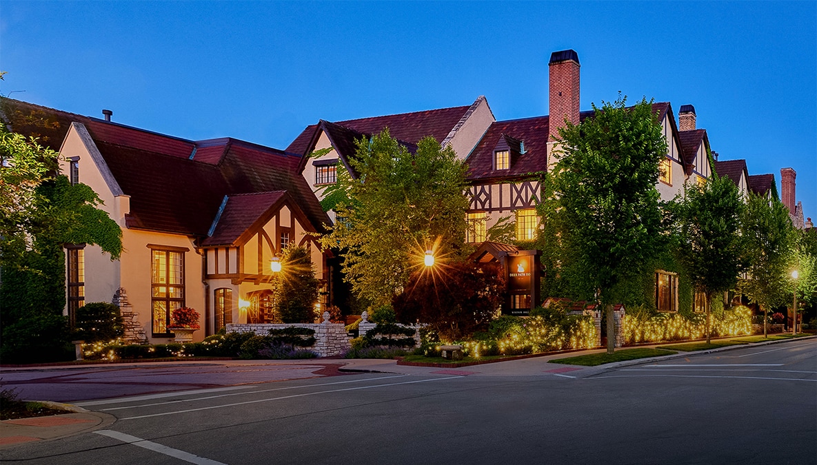 a large house with trees in front of it